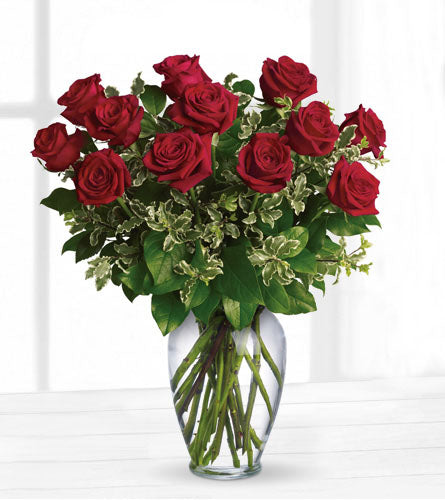 Always on My Mind - bouquet of red roses in a clear vase.