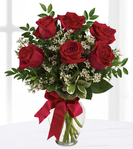 Thoughts of You - Six Roses - Bouquet of six red roses with white wax flowers and a red bow in a clear vase.