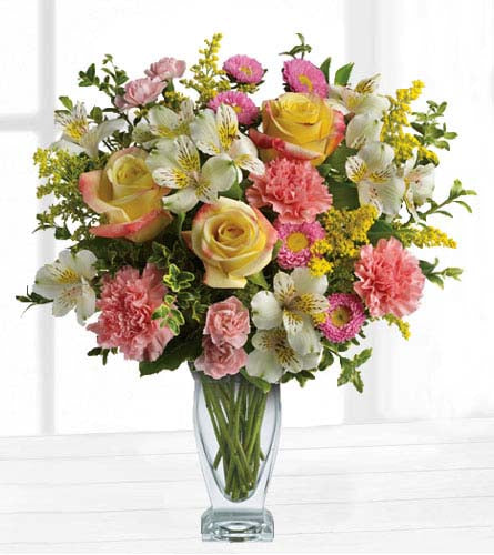 Meant to Be Bouquet - mixed pink, yellow and white flowers arranged in a clear glass vase.