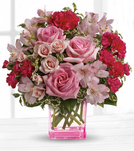 Teleflora's Pink Grace Bouquet - floral design of pink mixed flowers in a pink cube vase.