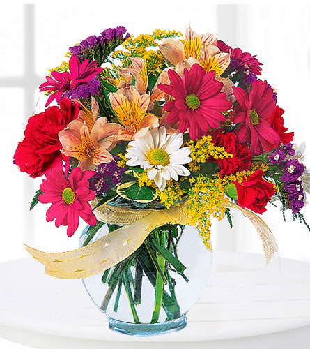 Joyful and Thrilling - Bouquet of colourful flowers in a clear vase with a yellow ribbon.