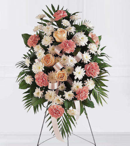 Gentle Thoughts Spray - floral arrangement with pink and white flowers with greenery on a stand.