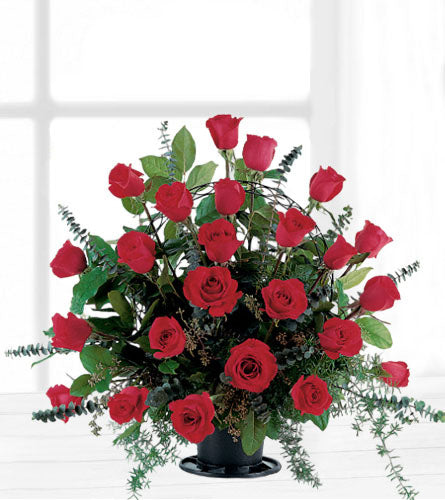 Blooming Red Roses Basket - arrangement of two dozen red roses with greenery in a black pot.