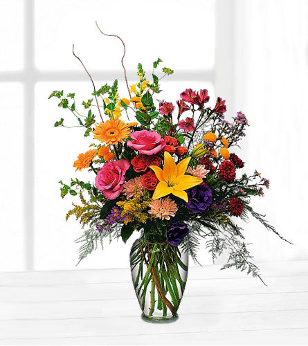 Every Day Counts - colourful bouquet of flowers in a clear vase.