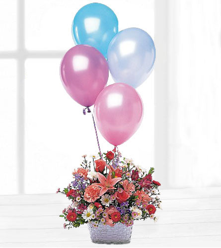 Birthday Balloon Basket - colourful floral arrangement with pink and blue balloons.