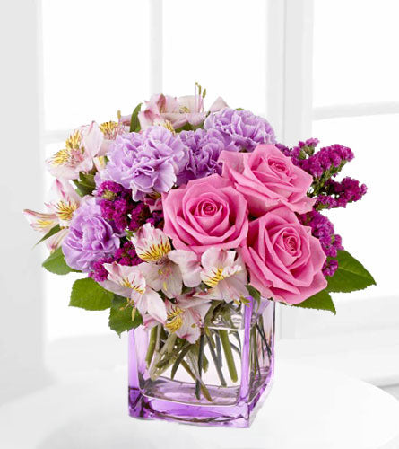 Beautiful Day - Bouquet of pink, purple and white flowers in a clear vase.