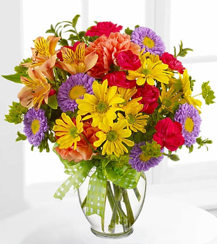 Teleflora's Make a Wish Bouquet - colourrful floral arrangement in a clear glass vase.