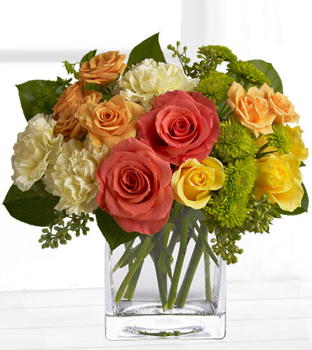 Citrus Splash - bouquet of multicolored roses in a clear cube glass vase.