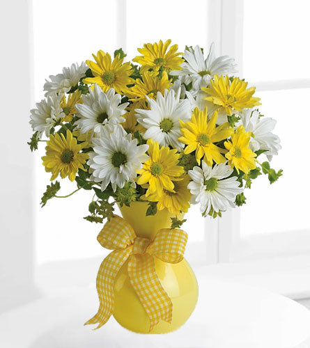 Upsy Daisy - bouquet of yellow and white dasies in a yellow vase with a checkered bow