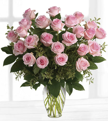 Something Sweet Premium Bouquet - arrangement of two dozen pink roses with greenery in a clear vase.